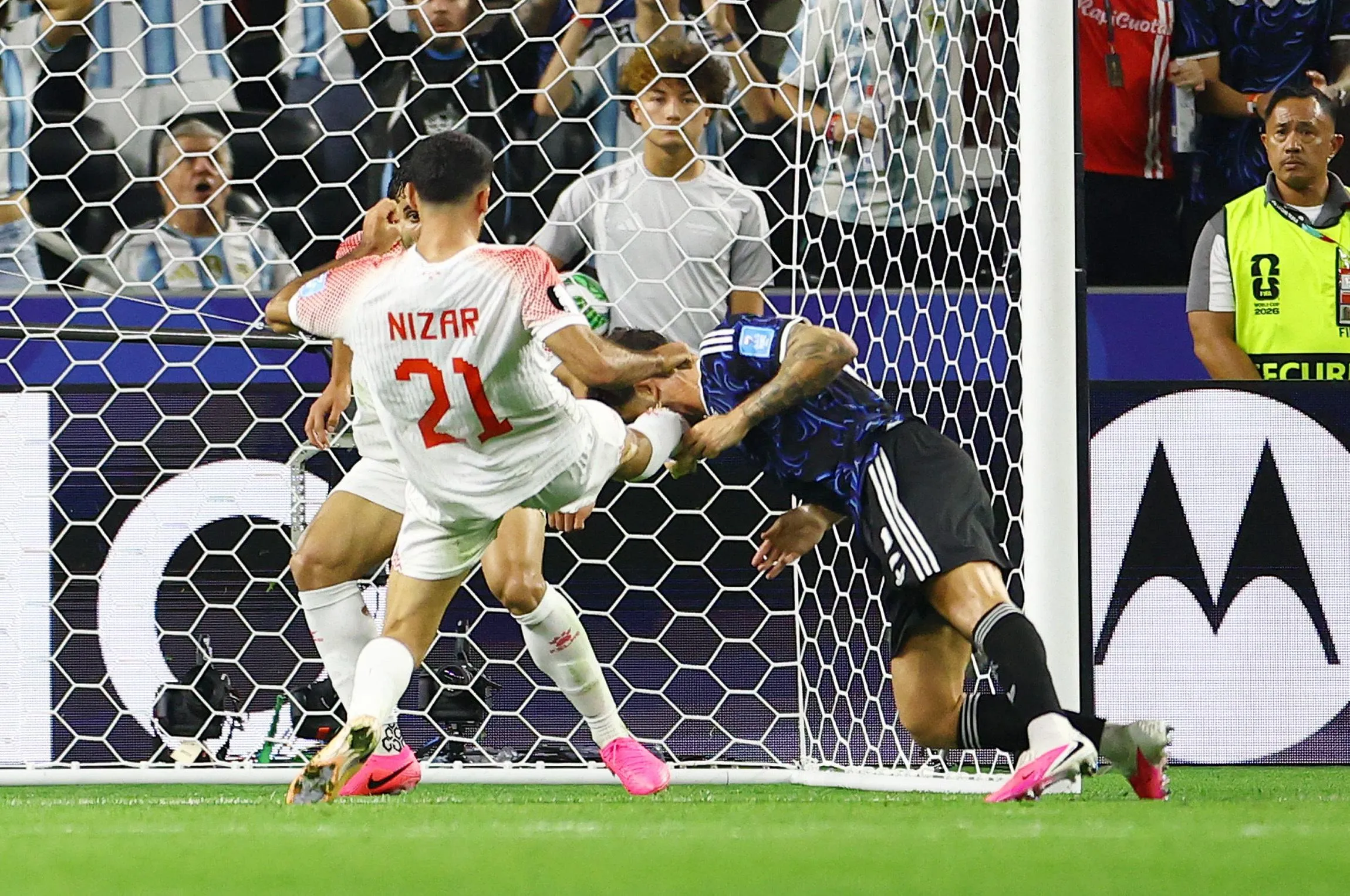 Nizar Alrashdan fouls Argentina's Marcos Senesi to concede the penalty.