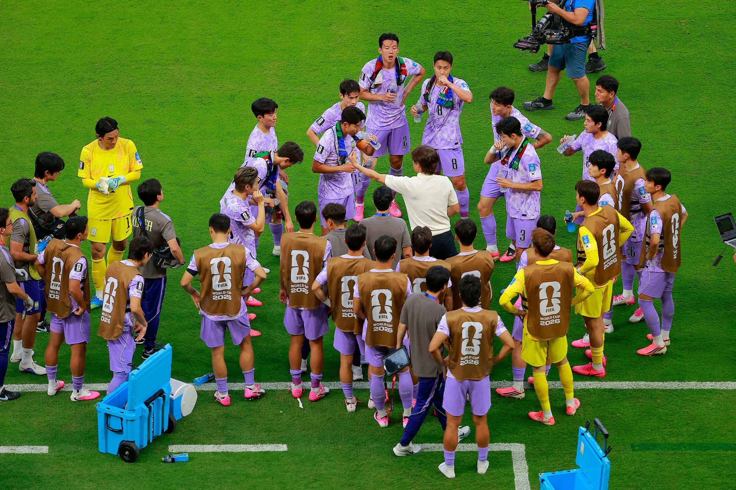 South Korea coach Hong Myung-bo gives out instructions during a hydration break at Guadalajara Stadium