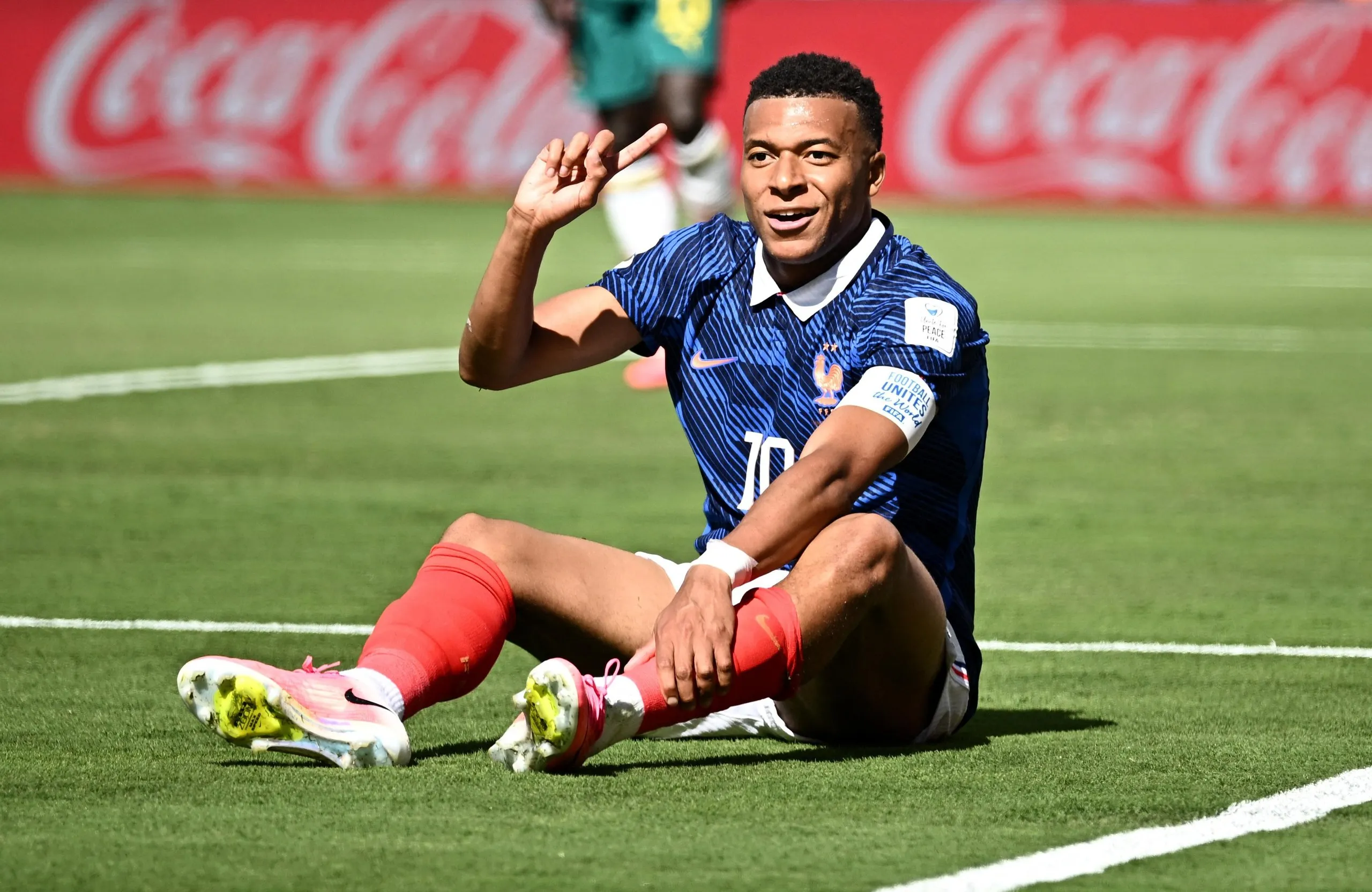 France’s Kylian Mbappé reacts after a challenge in the penalty area by Senegal’s Sadio Mané