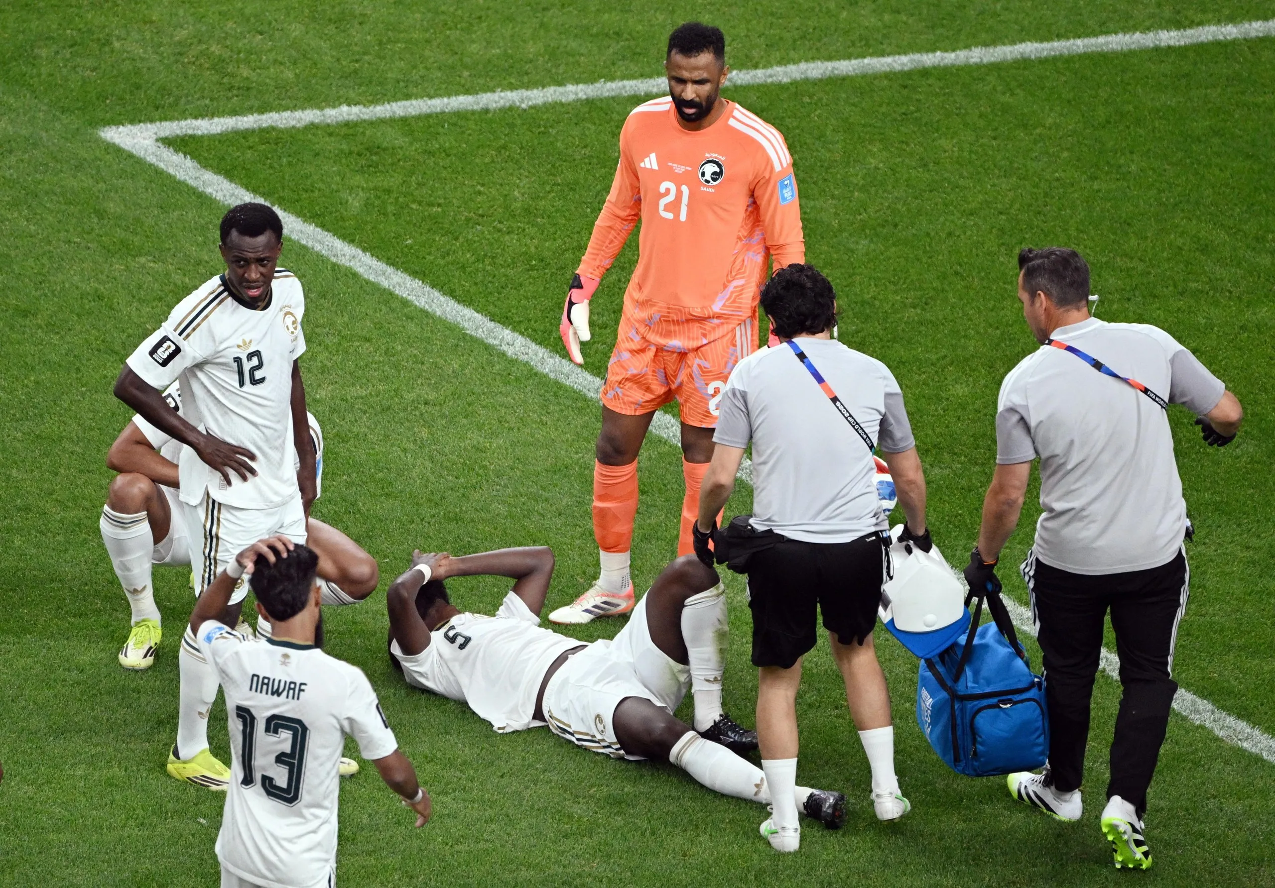 Hassan Altambakti receives medical attention after sustaining an injury