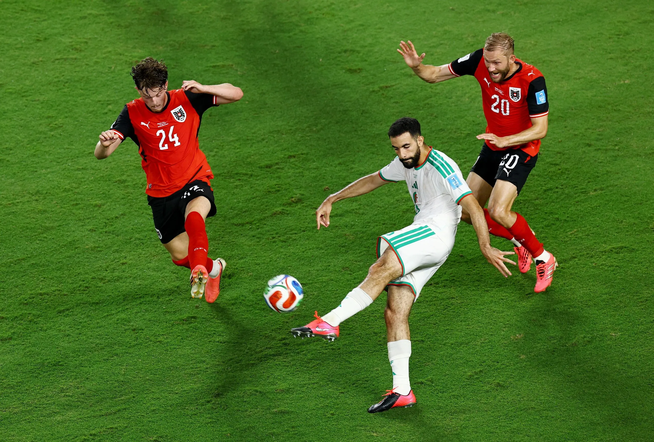 Rayan Ait Nouri in action with Austria's Paul Wanner and Konrad Laimer