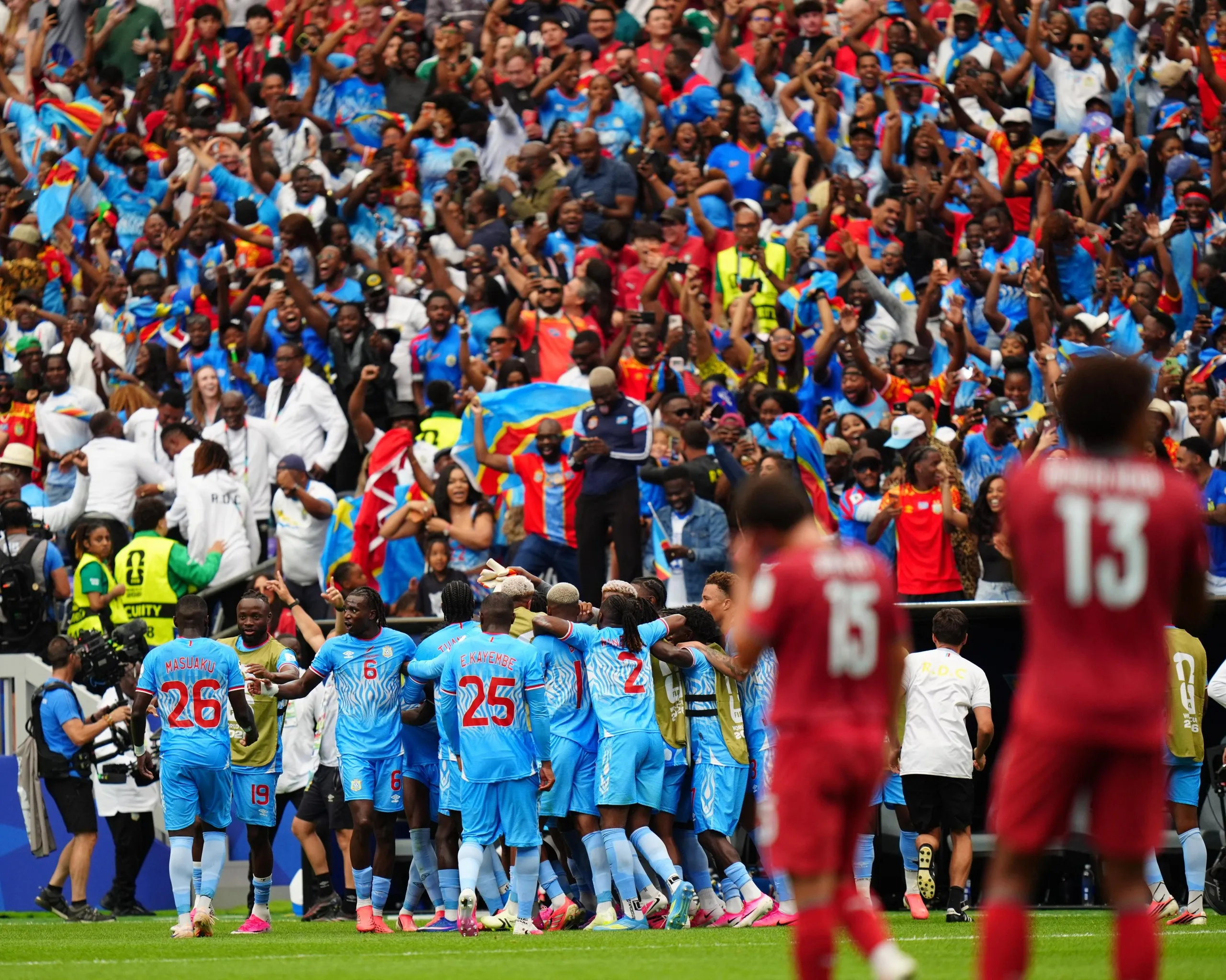 The Democratic Republic of the Congo’s fans and players celebrate their equalising goal in their1-1 World Cup group stage draw against Portugal in Houston, Texas.