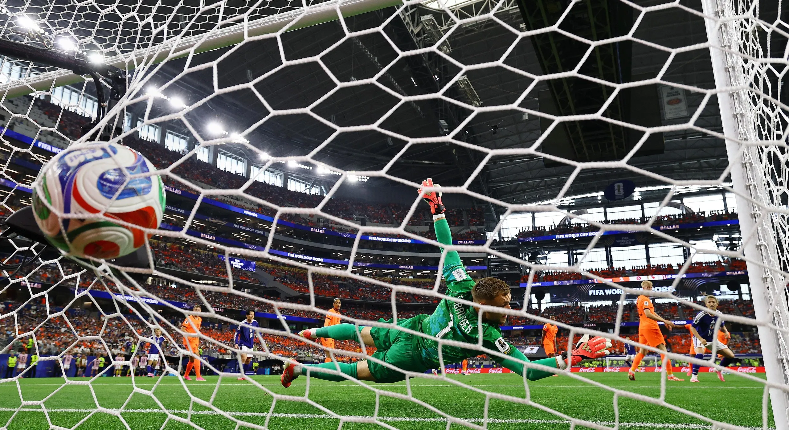 Japan's Keito Nakamura scores their first goal past Netherlands' Bart Verbruggen.