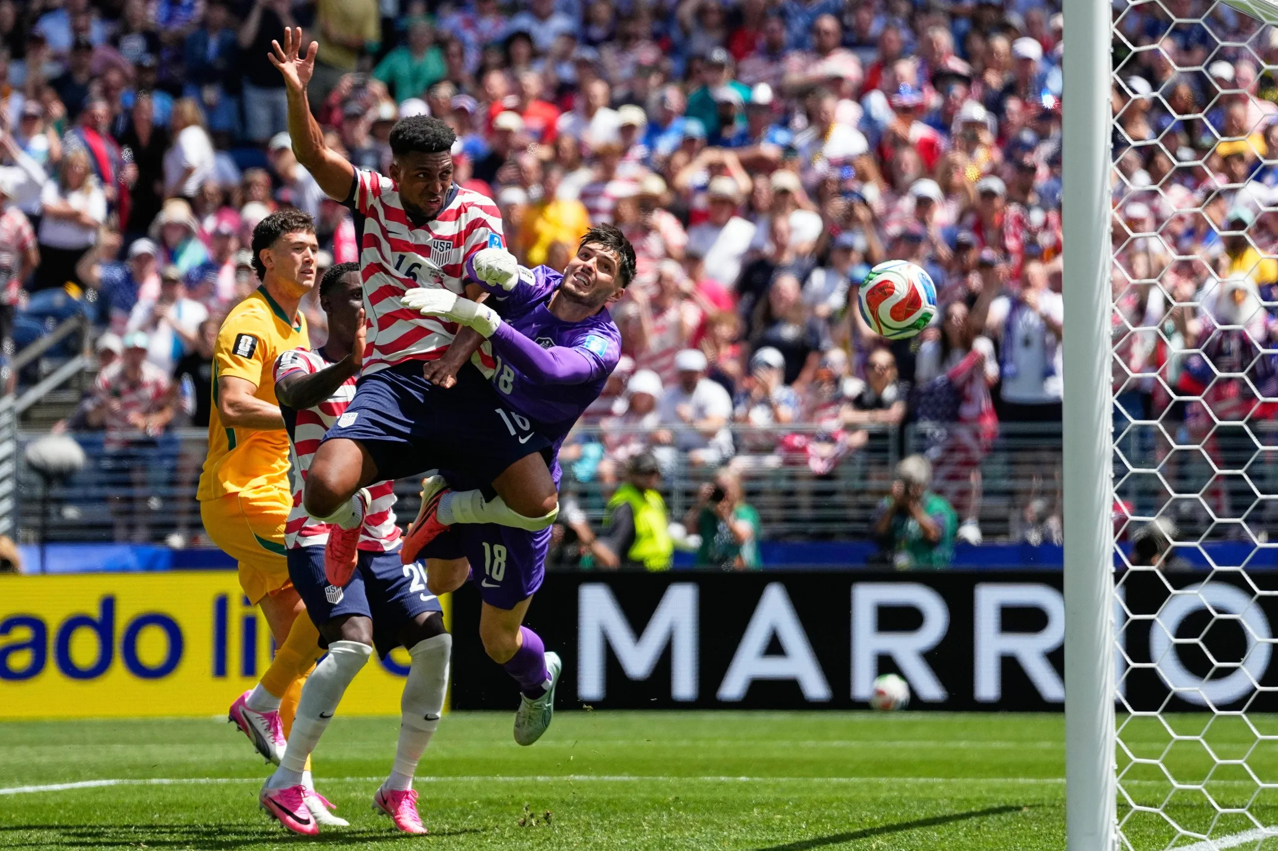 Alex Freeman, heads past Australia goalkeeper Patrick Beach