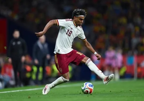 Spain's Lamine Yamal runs with the ball during an international friendly match against Egypt