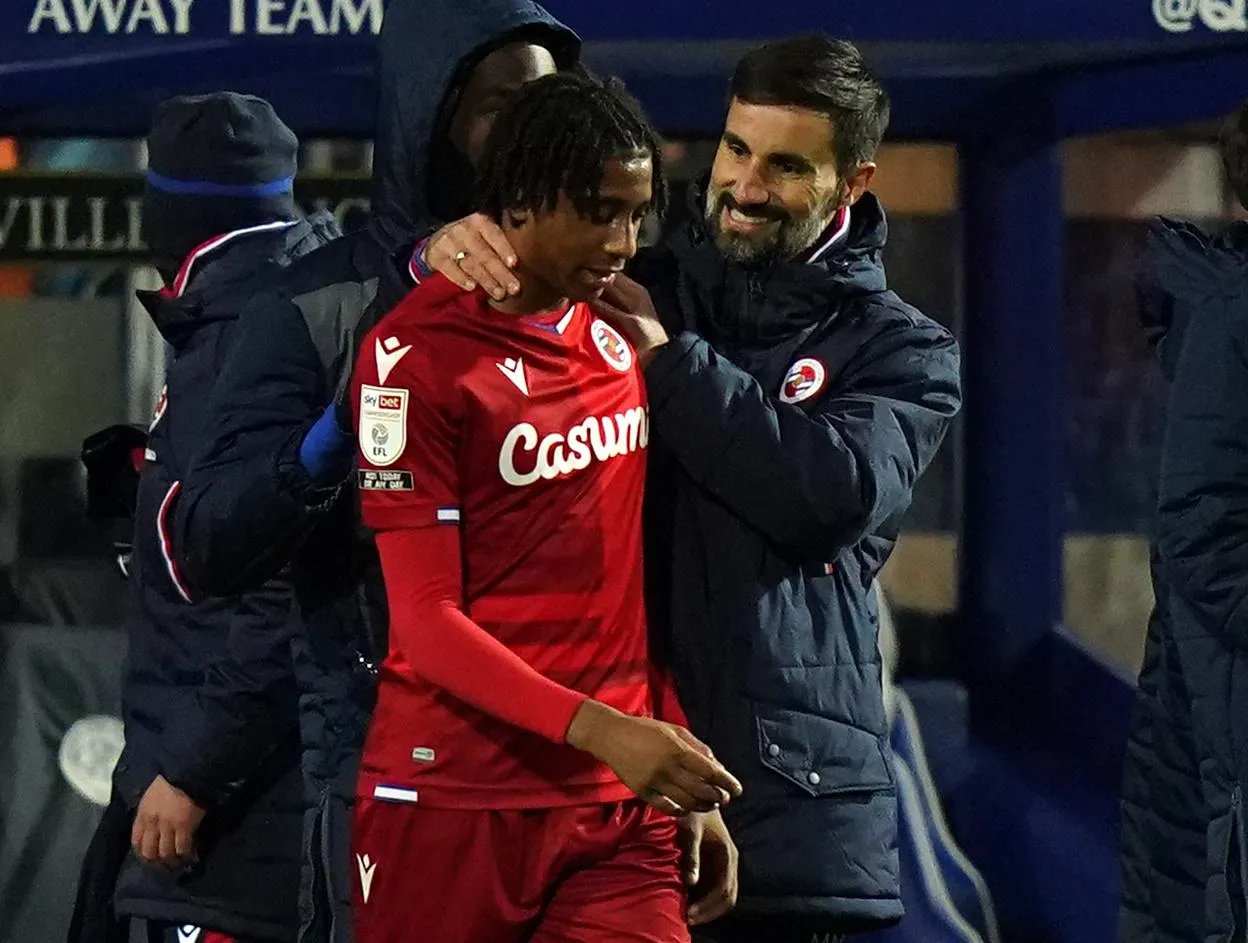 The Reading manager, Veljko Paunovic, celebrates with Michael Olise after a win at QPR in December 2020