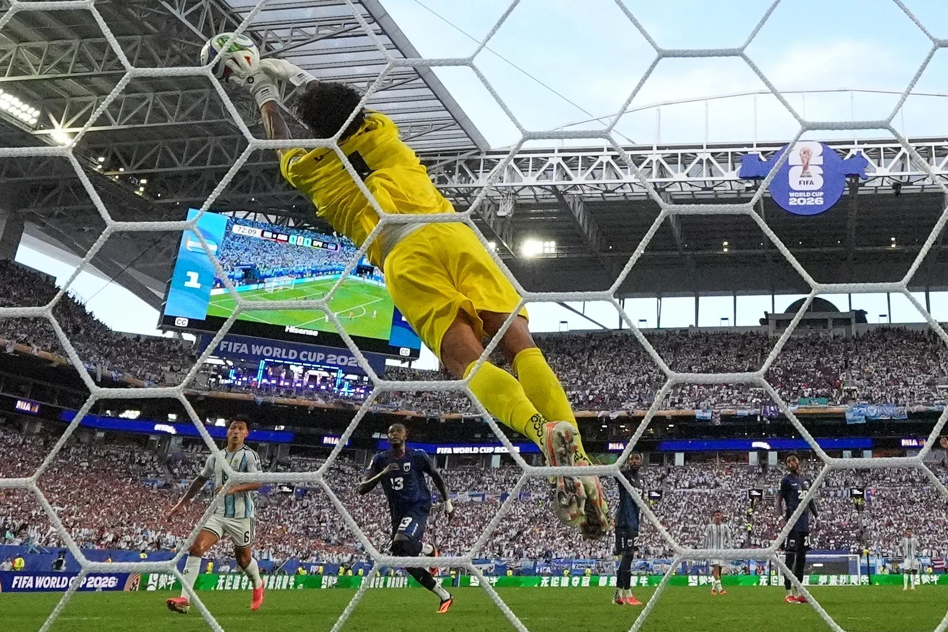 Vozinha claws away a clever free-kick from Lionel Messi that was floating ionto the top corner.