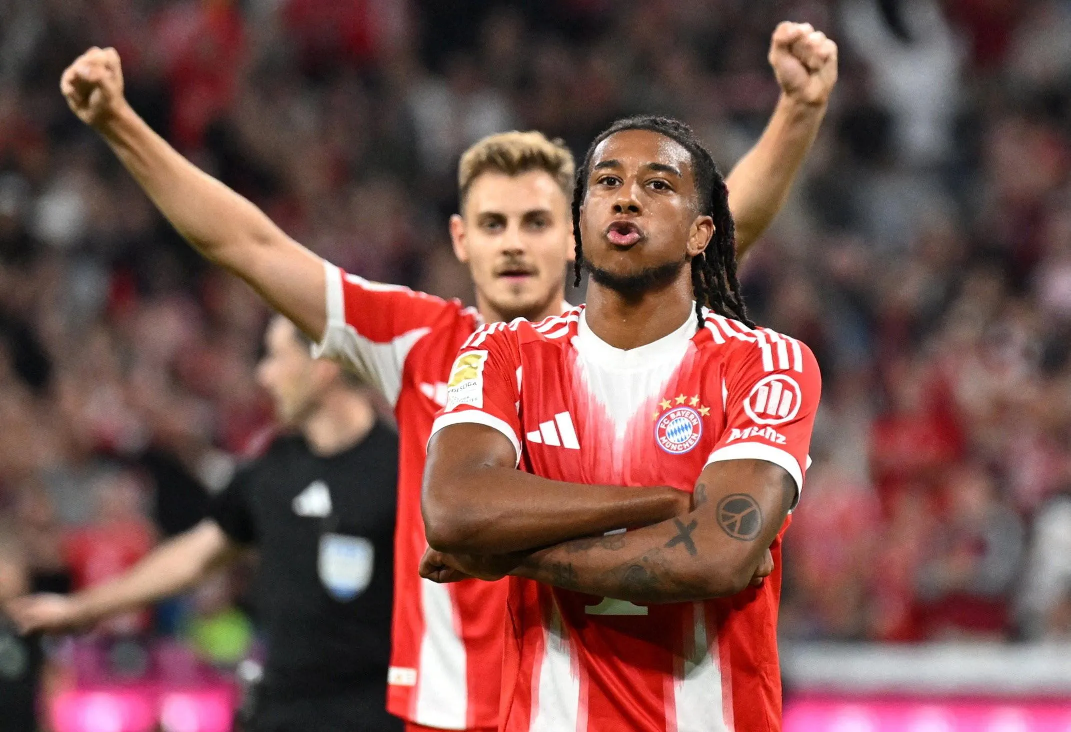 Michael Olise celebrates scoring for Bayern Munich against RB Leipzig in August 2025