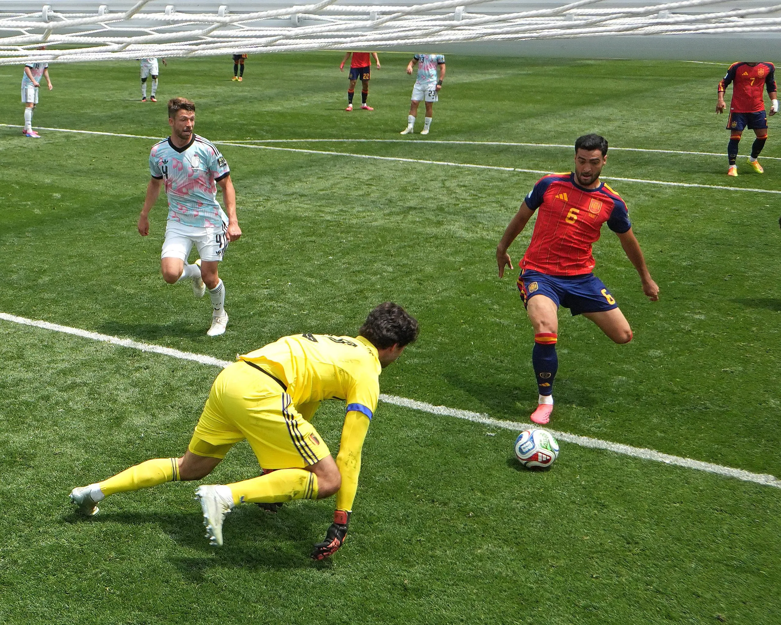 Mikel Merino scores Spain’s winner after Belgium keeper Senne Lammens spilled the ball.