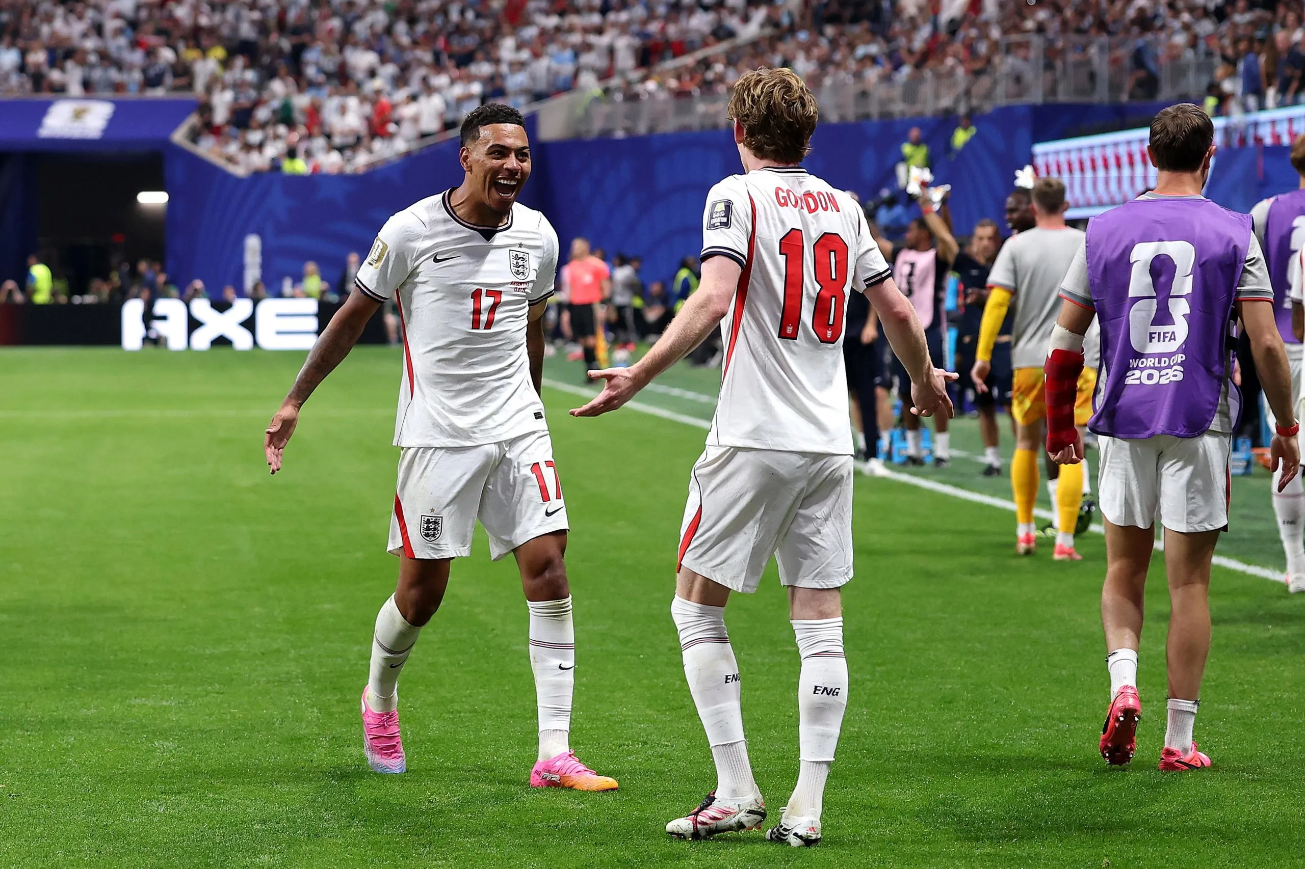Anthony Gordon celebrates with Morgan Rogers after scoring England’s goal against Argentina
